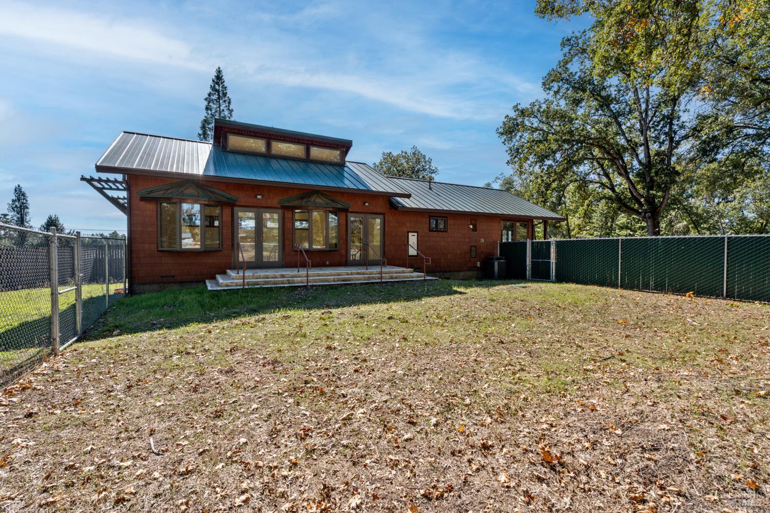 10185 East Road Redwood Valley, CA 95470 - Photo 12 of 17 front view of a house with a yard
