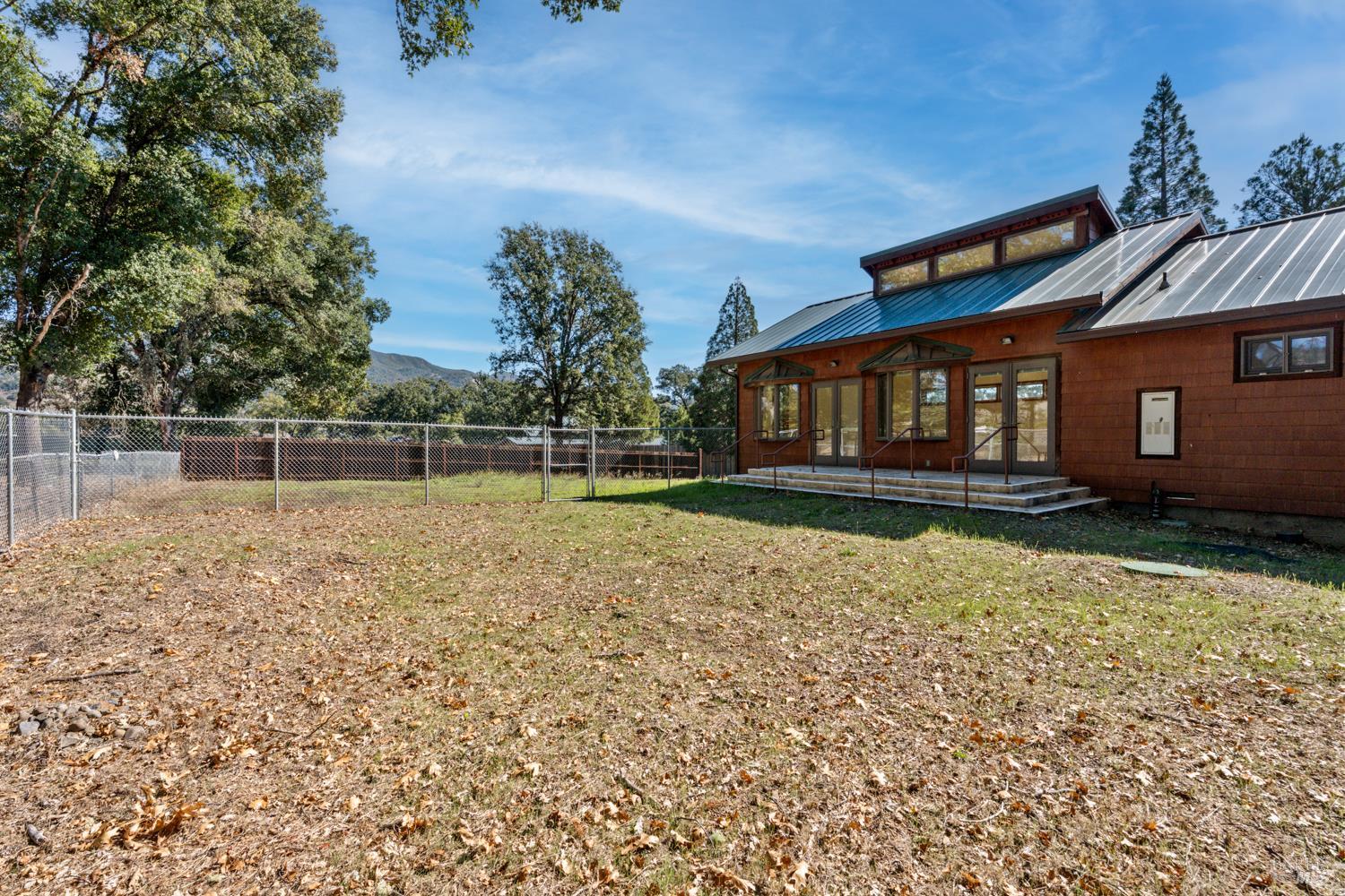 10185 East Road Redwood Valley, CA 95470 - Photo 13 of 17 front view of a house with a yard