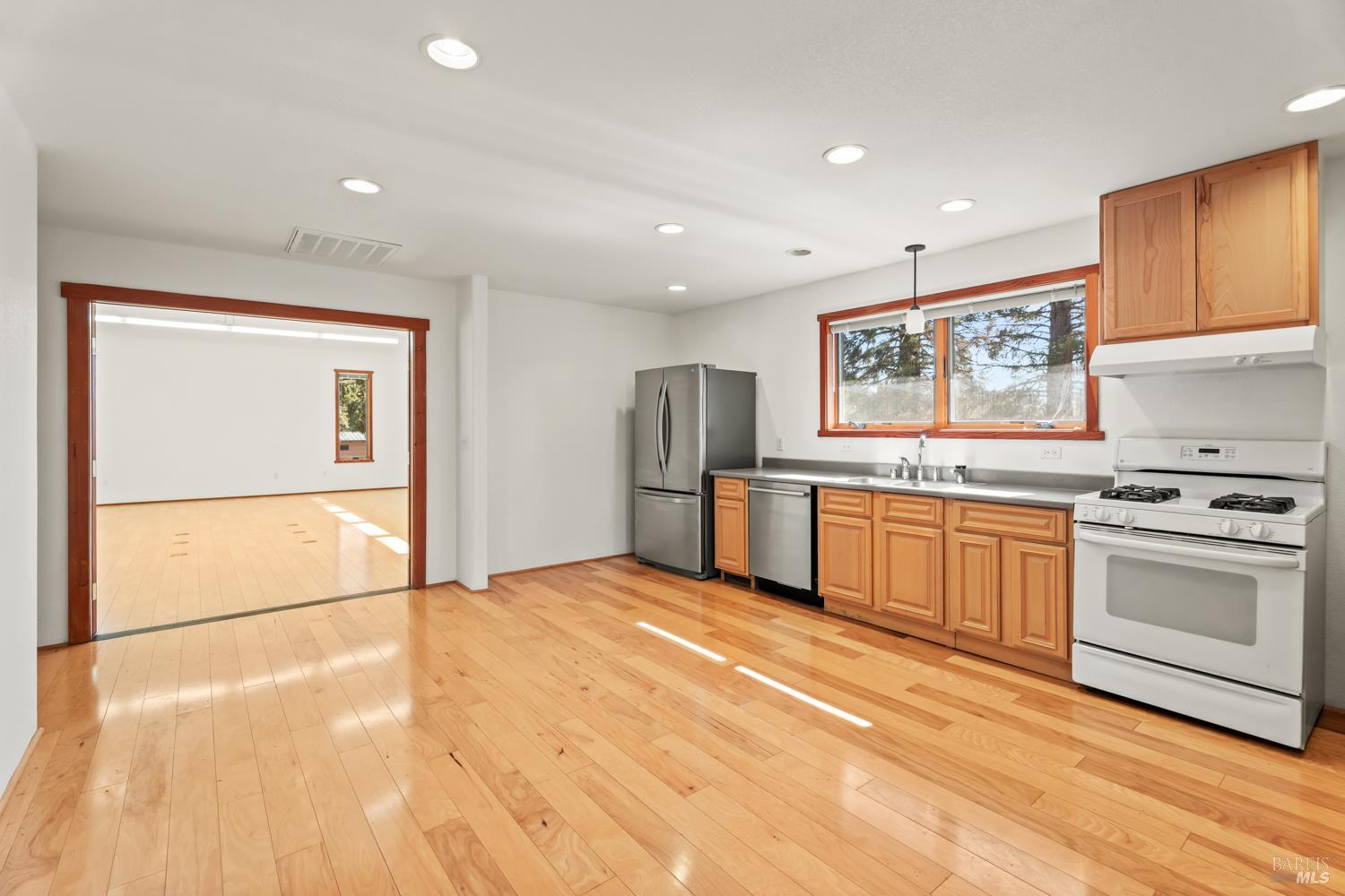 10185 East Road Redwood Valley, CA 95470 - Photo 7 of 17 a kitchen with stainless steel appliances granite countertop a stove a sink and a refrigerator