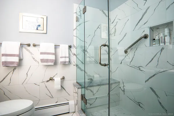 a bathroom with a toilet sink and tub