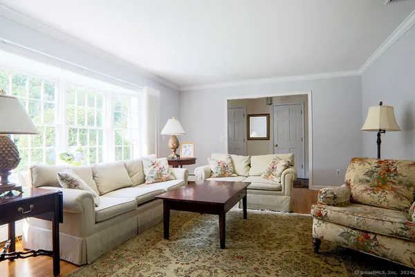 a living room with furniture and a large window