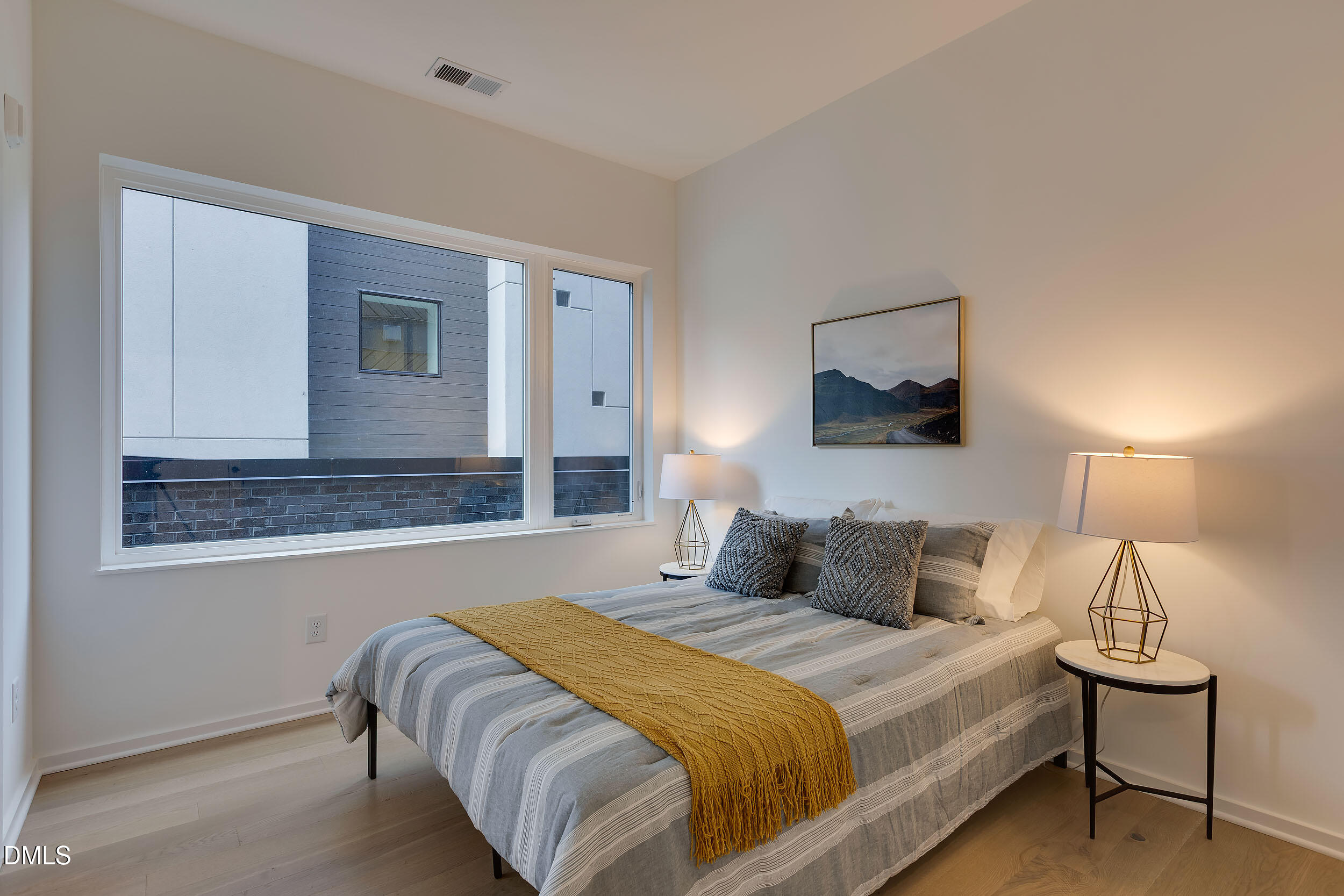 521 North Mangum Street, Unit 21 Durham, NC 27701 - Photo 12 of 21 a bedroom with a bed and a night stand