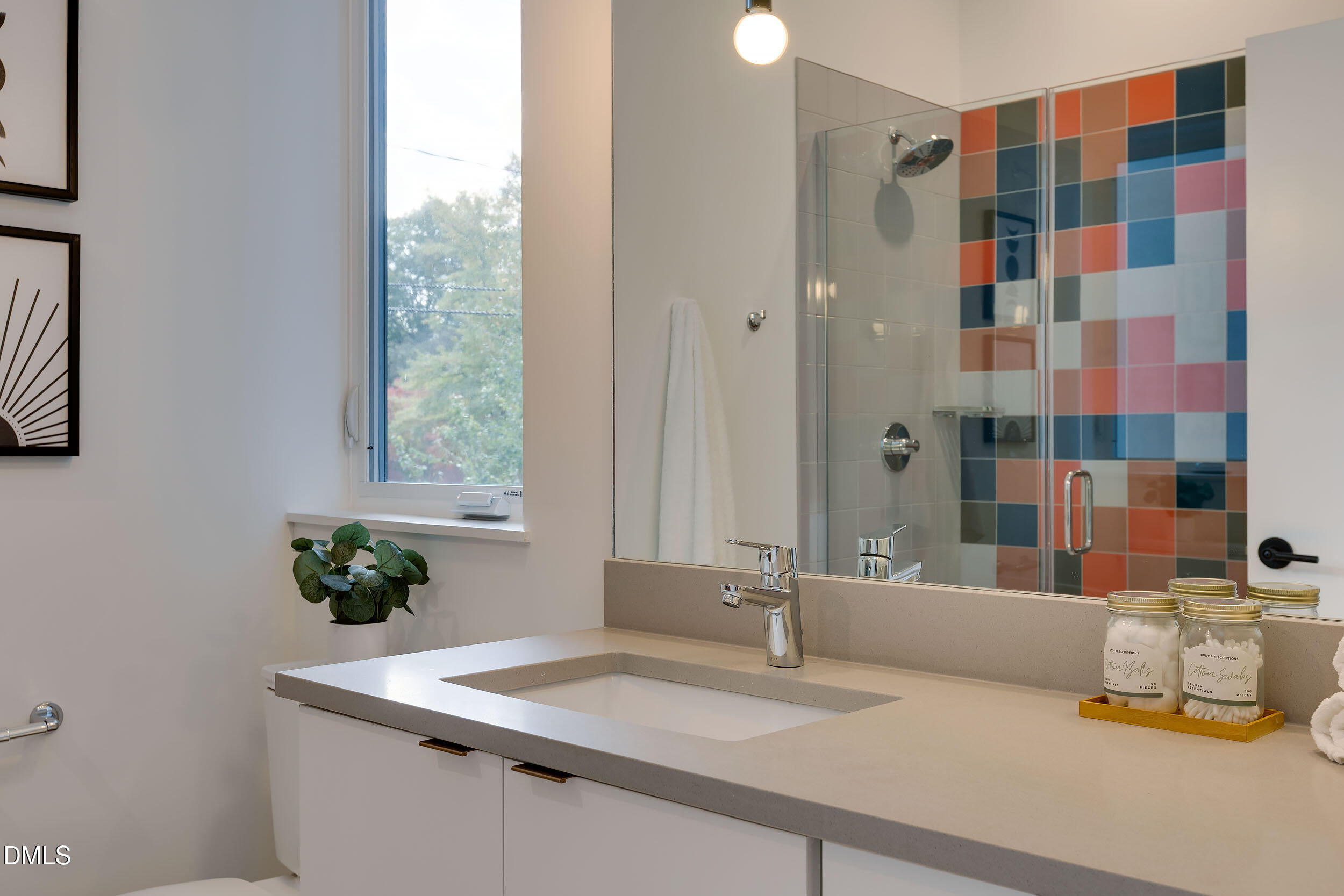 521 North Mangum Street, Unit 21 Durham, NC 27701 - Photo 14 of 21 a bathroom with a granite countertop sink a mirror a and a shower