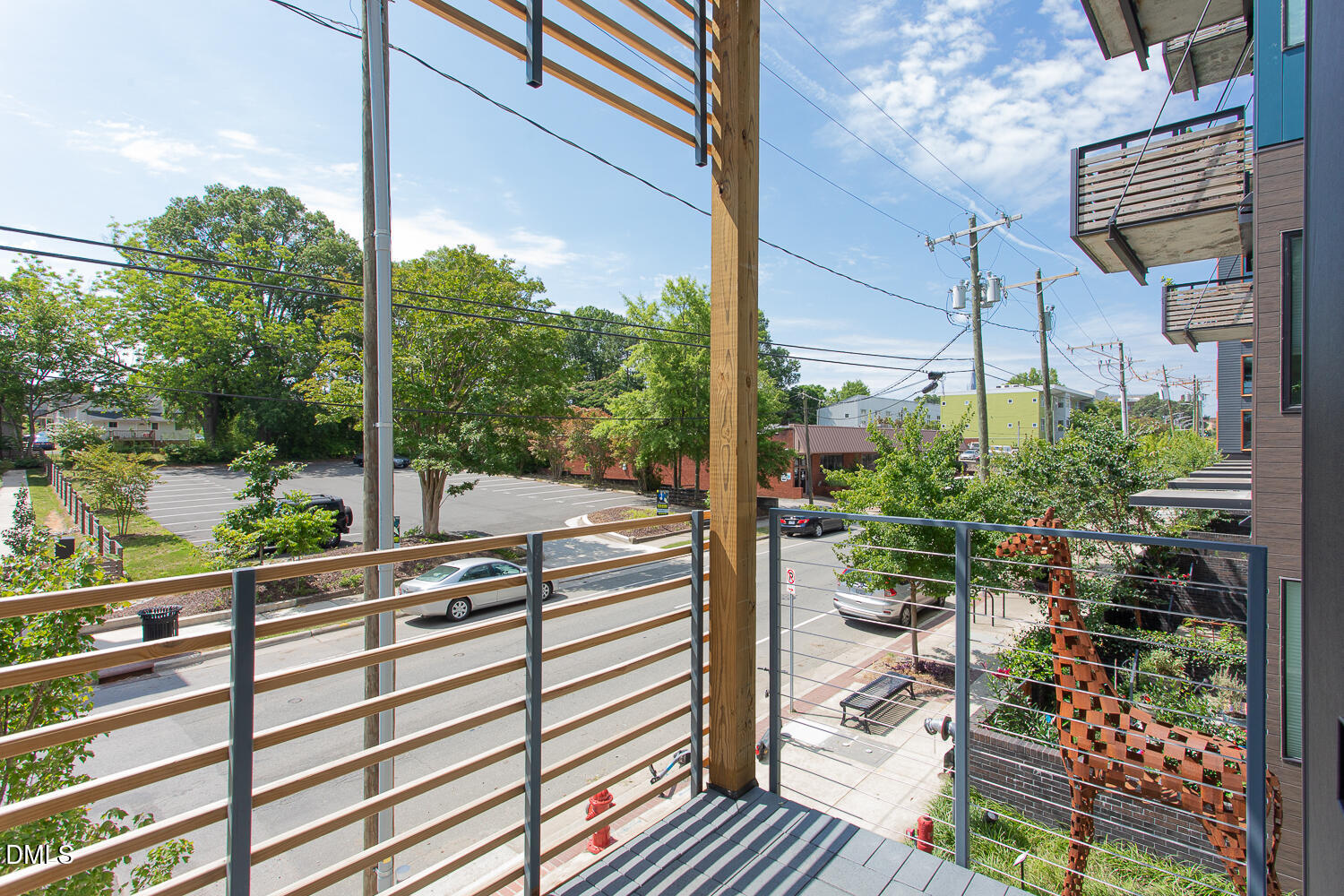 521 North Mangum Street, Unit 21 Durham, NC 27701 - Photo 20 of 21 a view of a balcony with potted plants