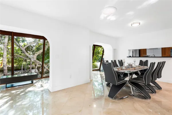 a view of a dining room with furniture window and outside view