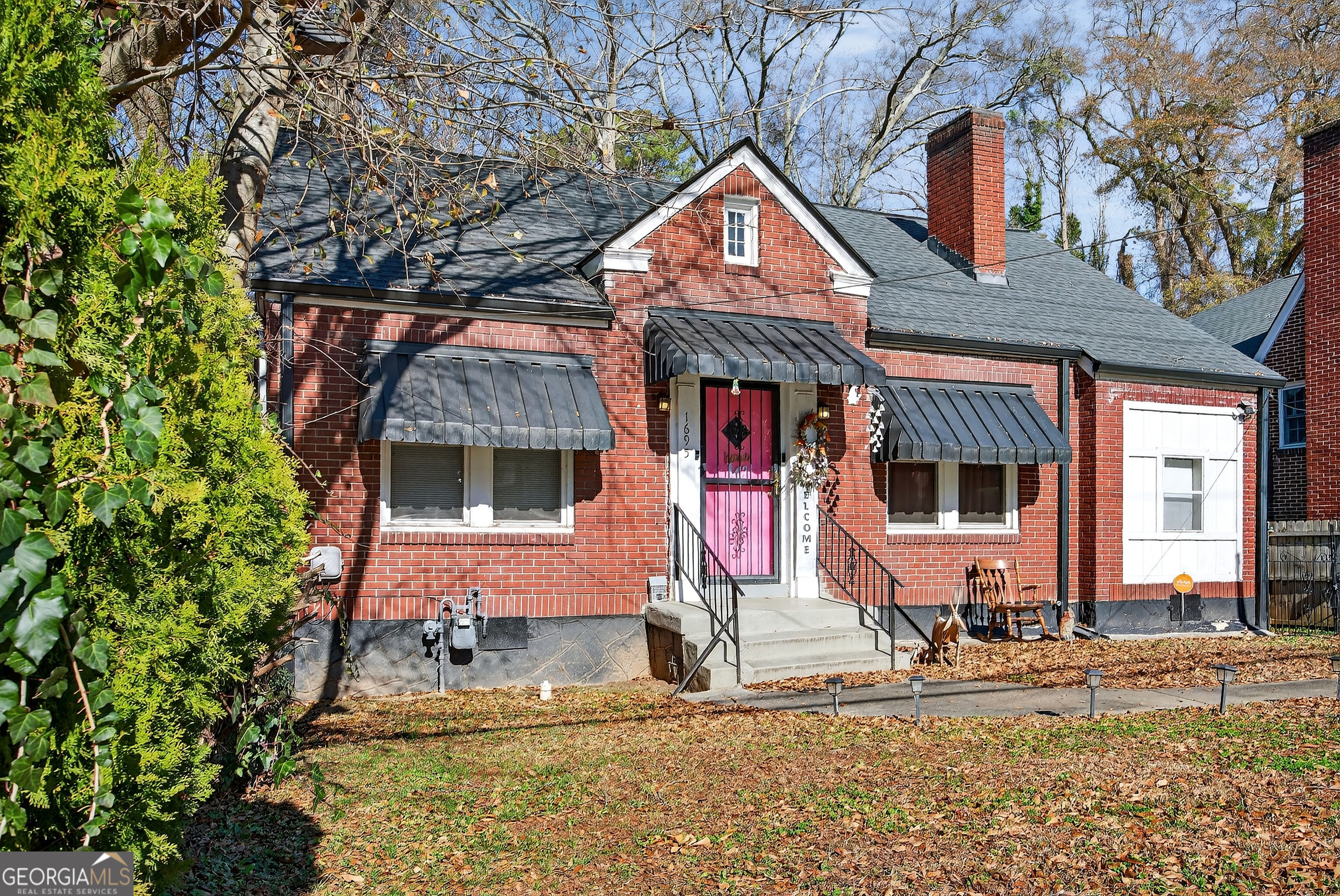 1695 Beecher Street Southwest Atlanta, GA 30310 - Photo 2 of 23 a front view of a house with garden