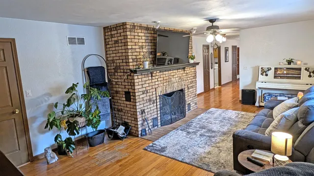 a living room with furniture and a fireplace