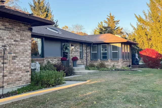 a front view of a house with garden