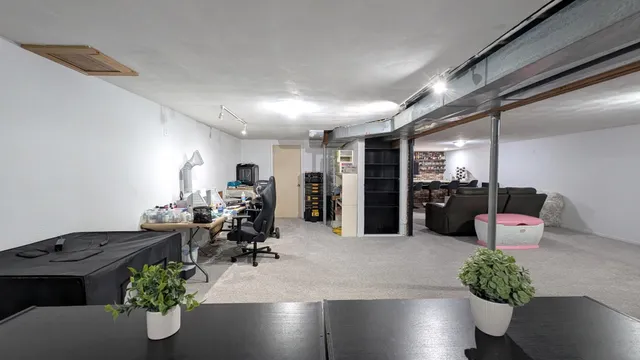 a room with gym equipment and a large window