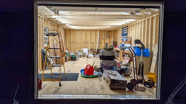 a view of a living room with entryway and furniture