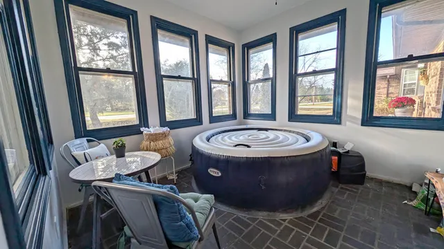 a front view of a house with a garden and plants