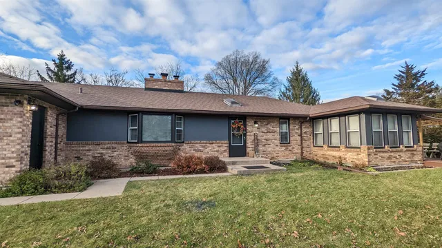 a view of a field of grass and trees