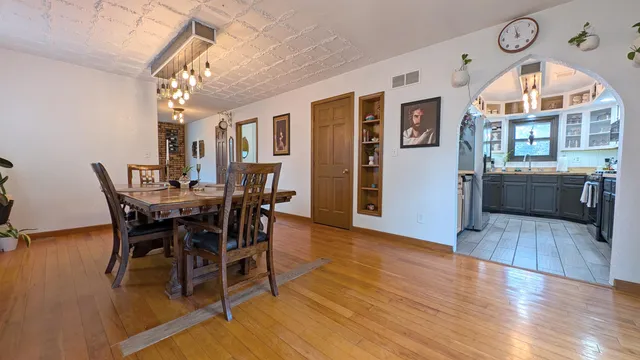 a view of a dining room with furniture window and wooden floor