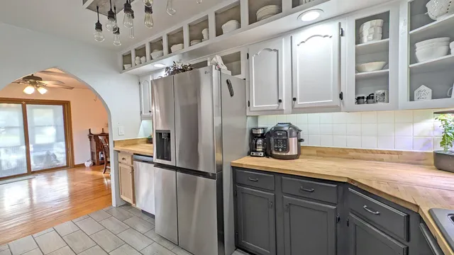 a kitchen with cabinets and stainless steel appliances
