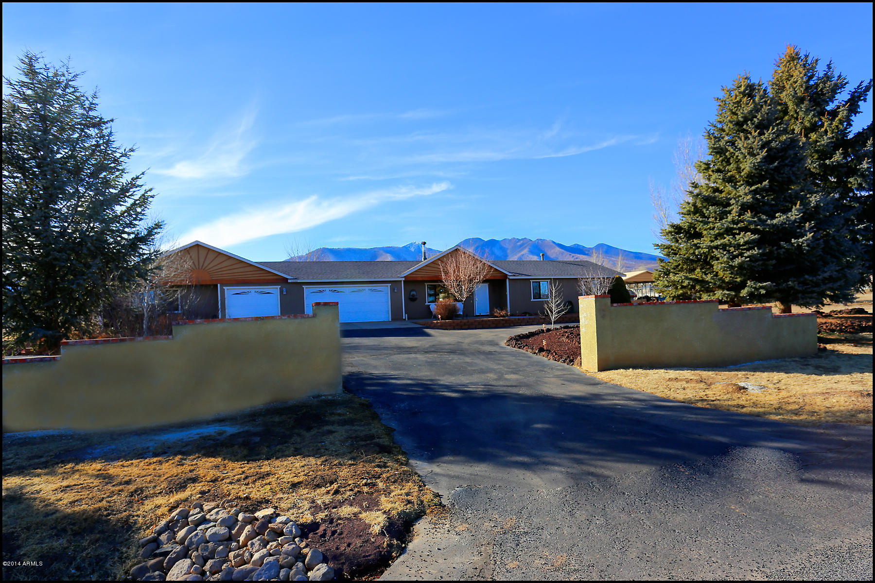 11240 Rodeo Road Flagstaff, AZ 86004 - Photo 1 of 11 Drive way with mountains in background