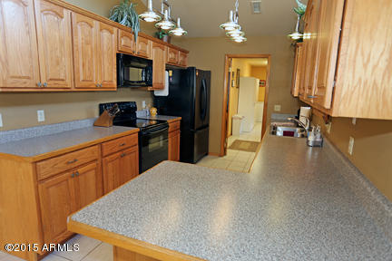 11240 Rodeo Road Flagstaff, AZ 86004 - Photo 6 of 11 Kitchen counters/cabinets