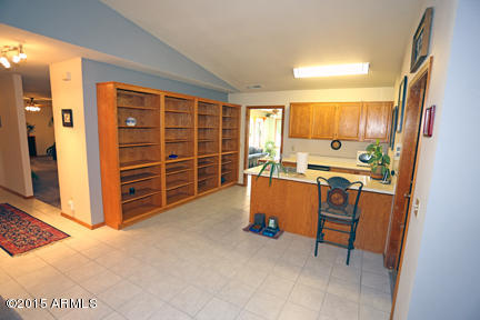 11240 Rodeo Road Flagstaff, AZ 86004 - Photo 9 of 11 Built-in Oak book/storage shelves