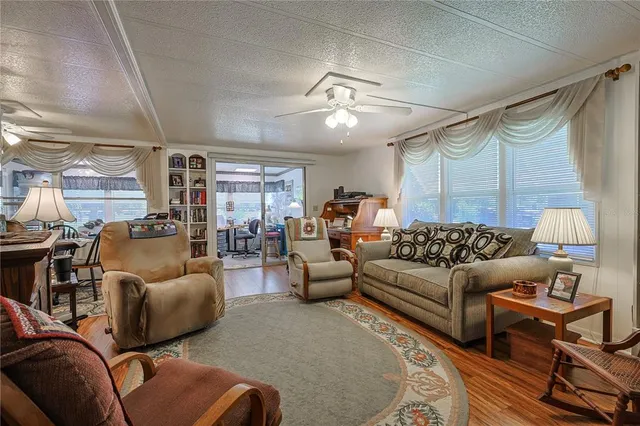 a dining room with furniture and a window