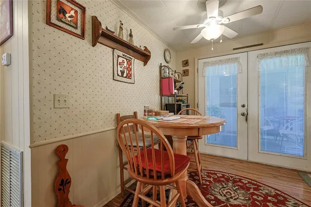 a bedroom with a bed and a flat tv screen on the dresser