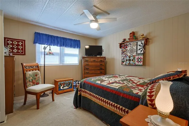 a bed room with a bed and a book shelf