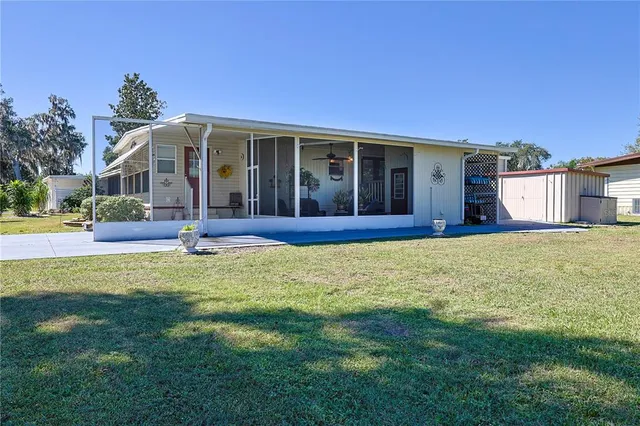 a view of a house with a garden and yard