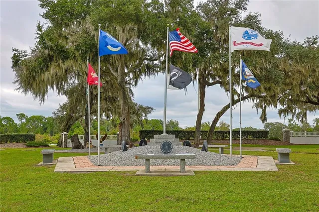 a garden with trees in the background
