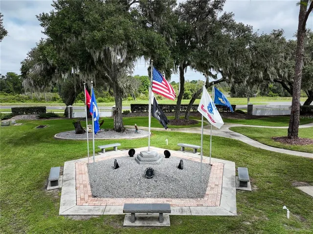an aerial view of a golf course with chairs