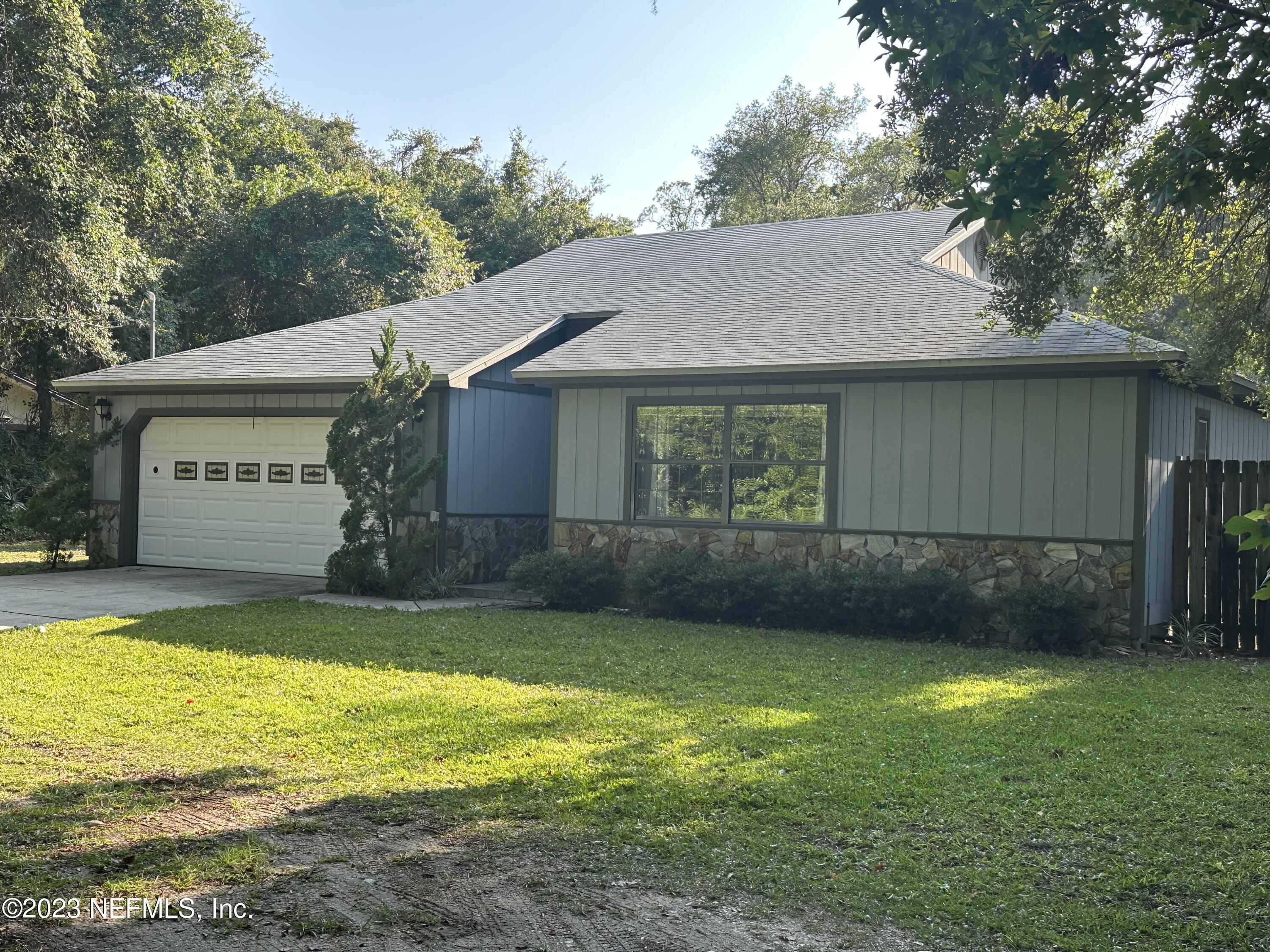 2797 Kings Road St. Augustine, FL 32086 - Photo 1 of 24 a front view of a house with a yard