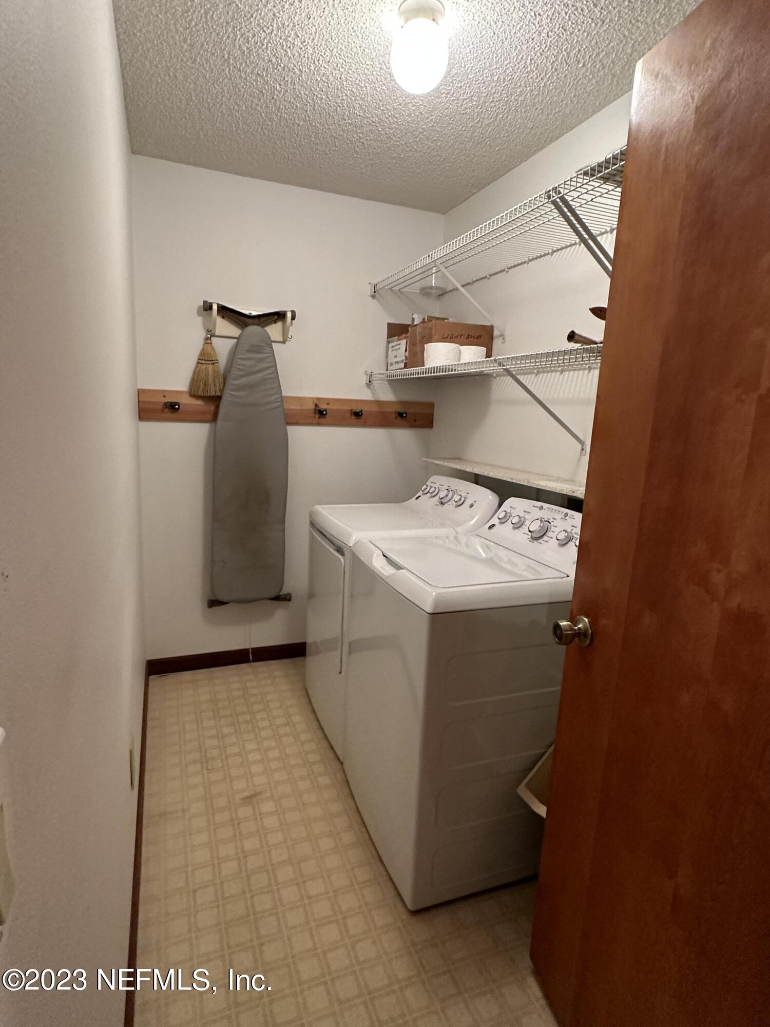 2797 Kings Road St. Augustine, FL 32086 - Photo 15 of 24 a utility room with dryer and washer