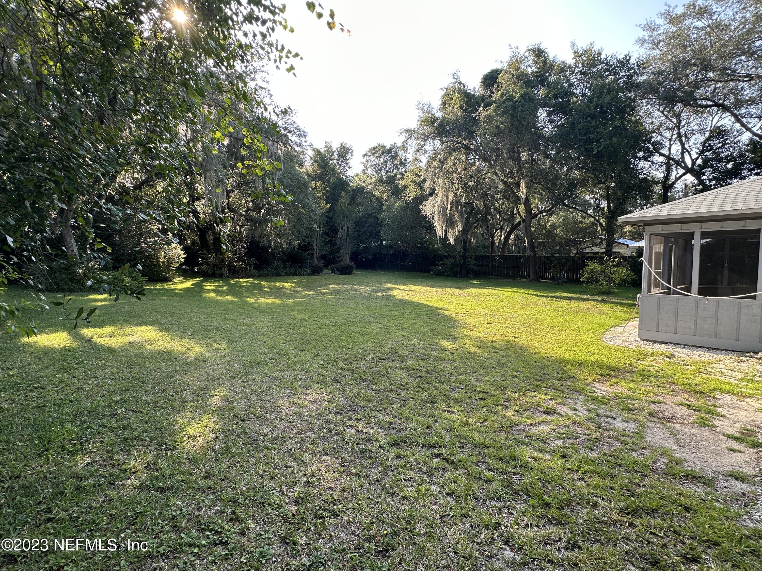 2797 Kings Road St. Augustine, FL 32086 - Photo 18 of 24 a view of a swimming pool with an outdoor space and seating area