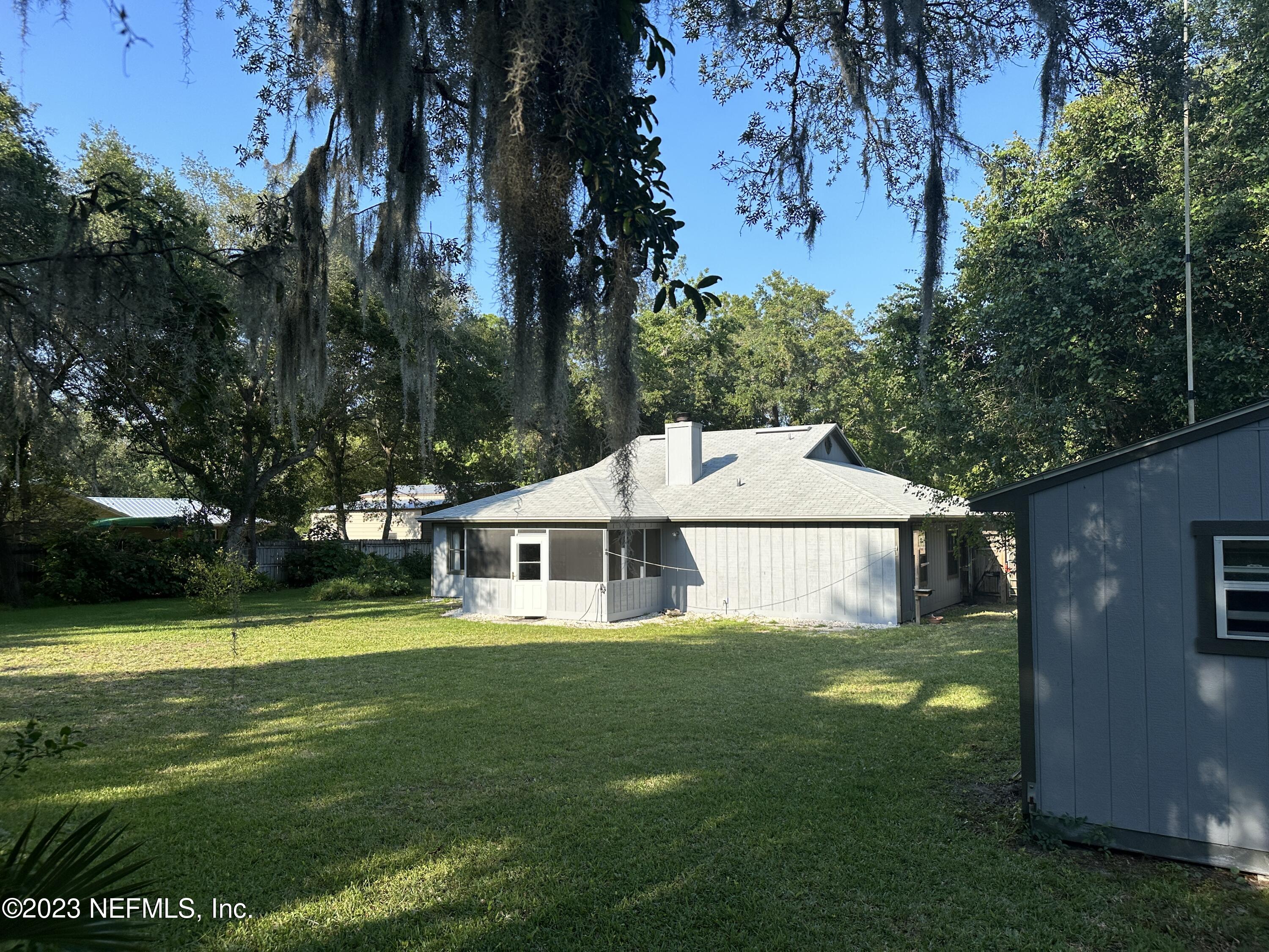 2797 Kings Road St. Augustine, FL 32086 - Photo 20 of 24 a view of a house with a big yard and sitting area