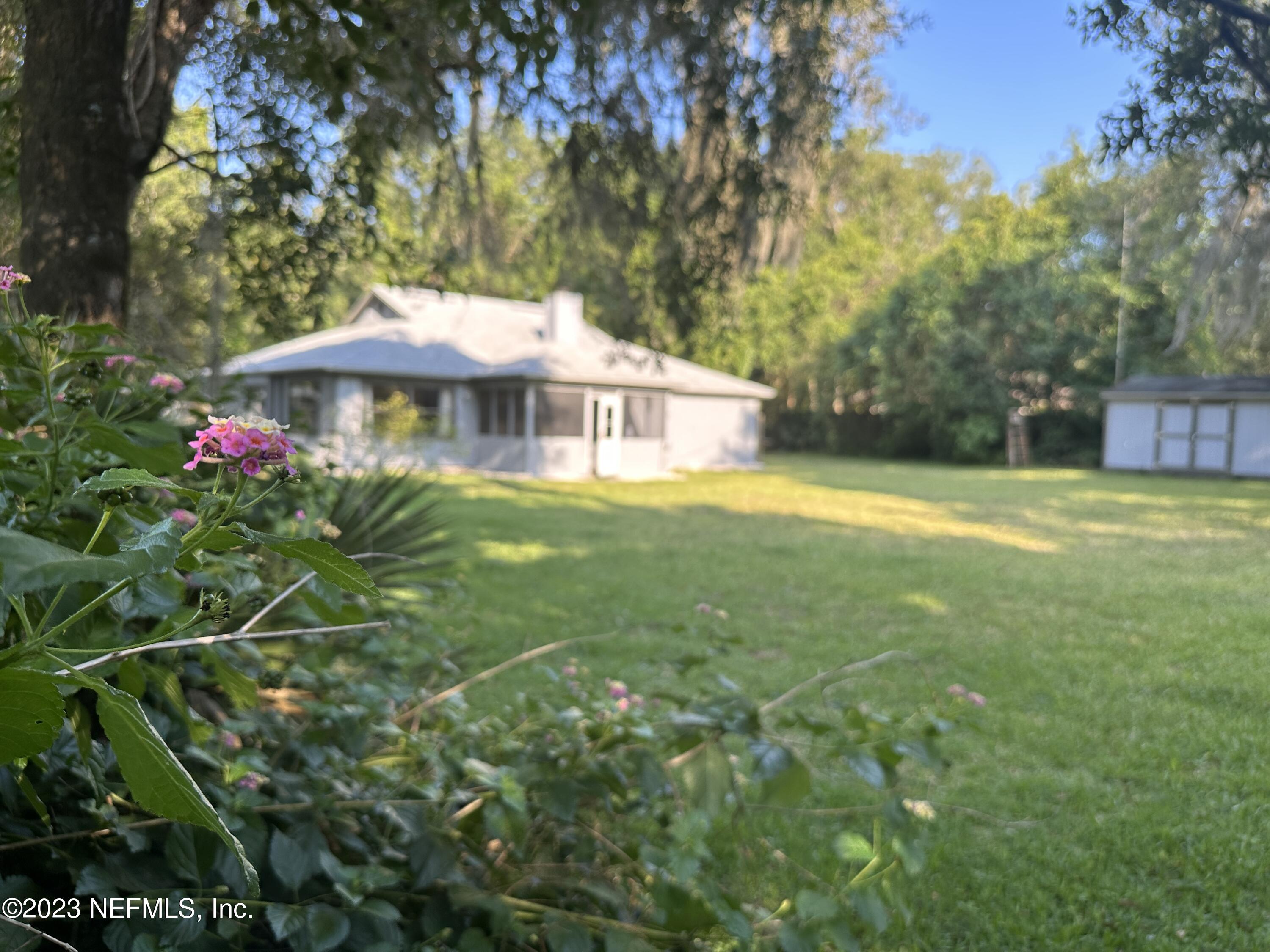 2797 Kings Road St. Augustine, FL 32086 - Photo 2 of 24 a front view of a house with yard
