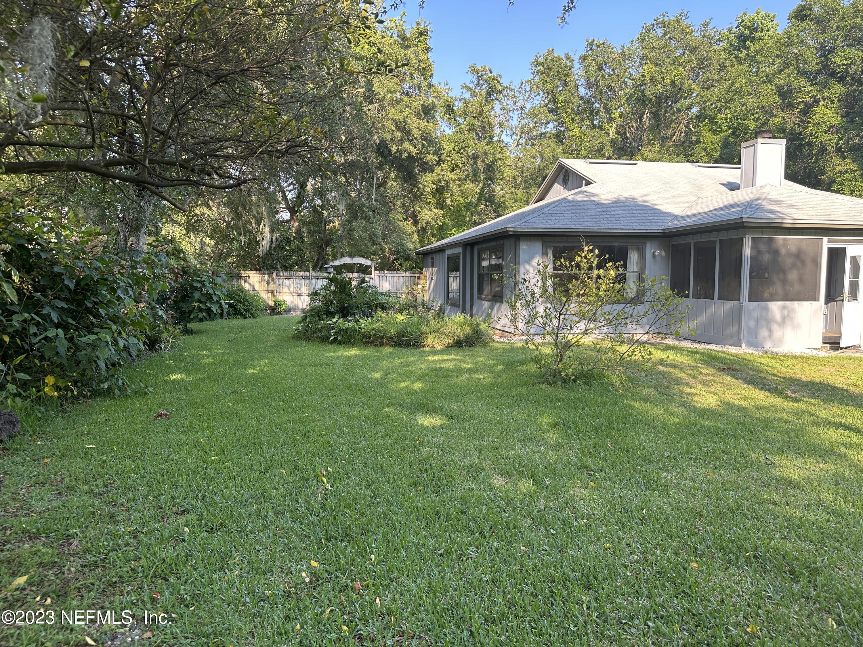 2797 Kings Road St. Augustine, FL 32086 - Photo 23 of 24 a front view of a house with garden