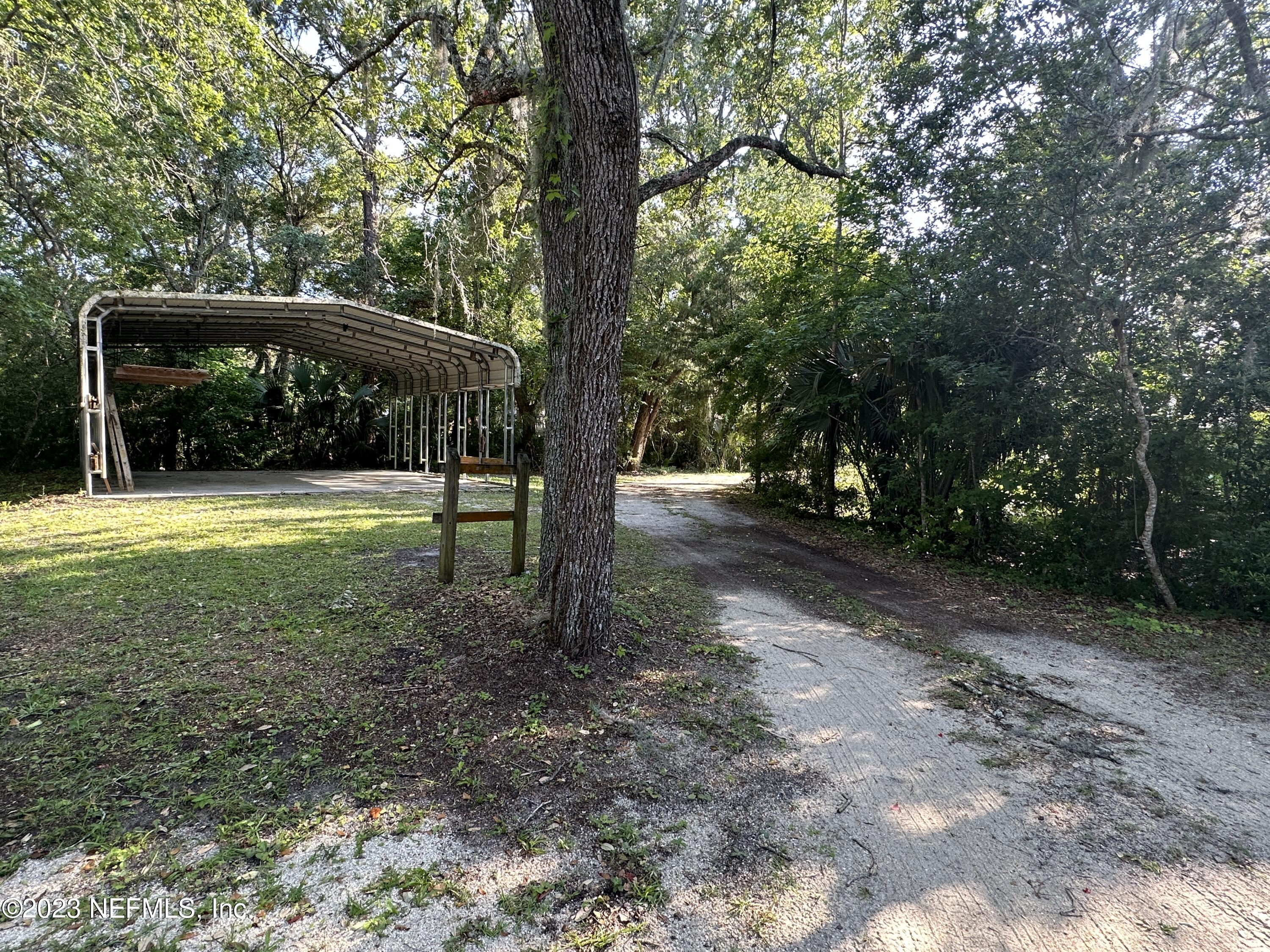 2797 Kings Road St. Augustine, FL 32086 - Photo 24 of 24 a view of outdoor space with trees all around