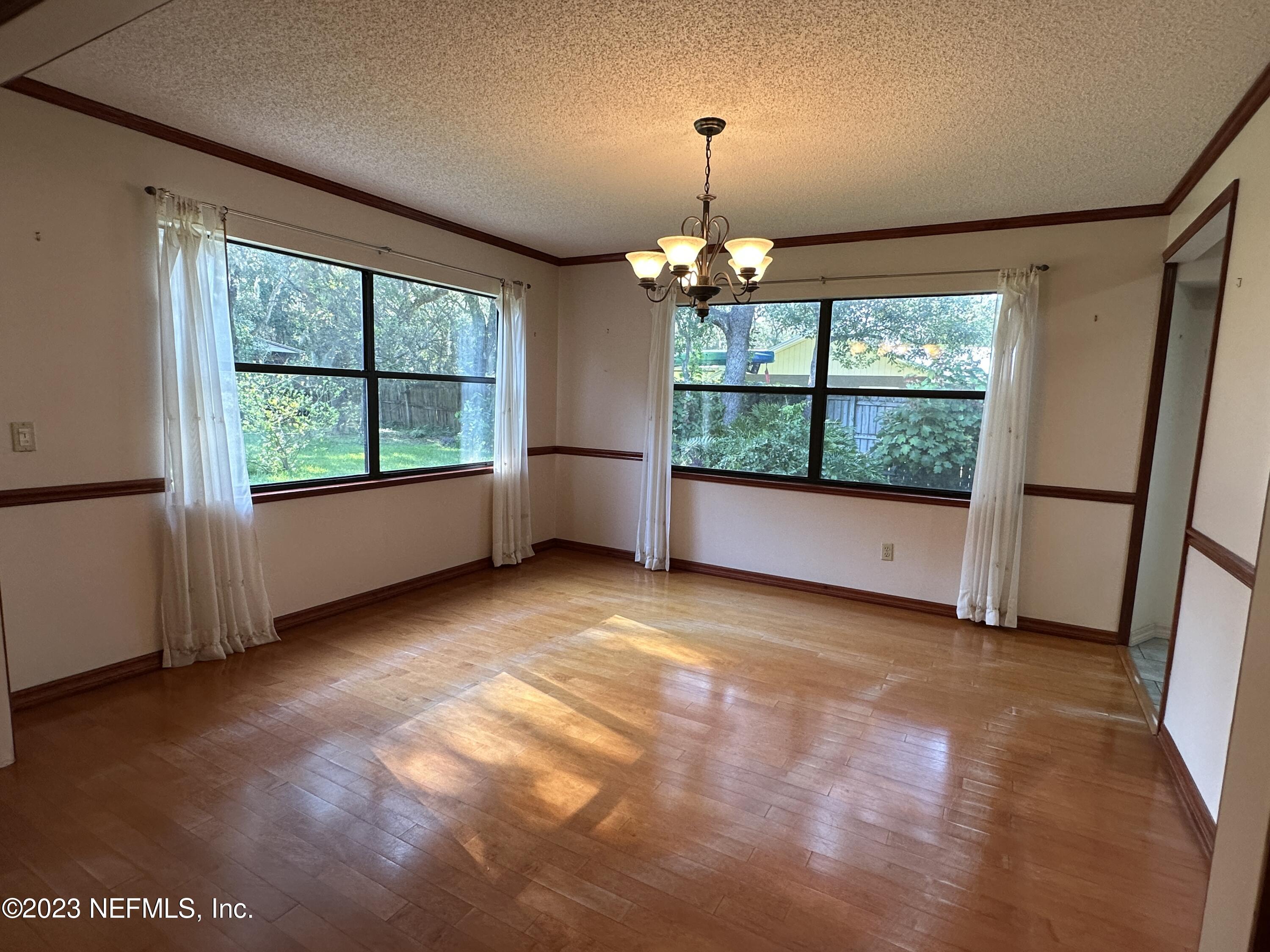 2797 Kings Road St. Augustine, FL 32086 - Photo 9 of 24 a view of an empty room with a window