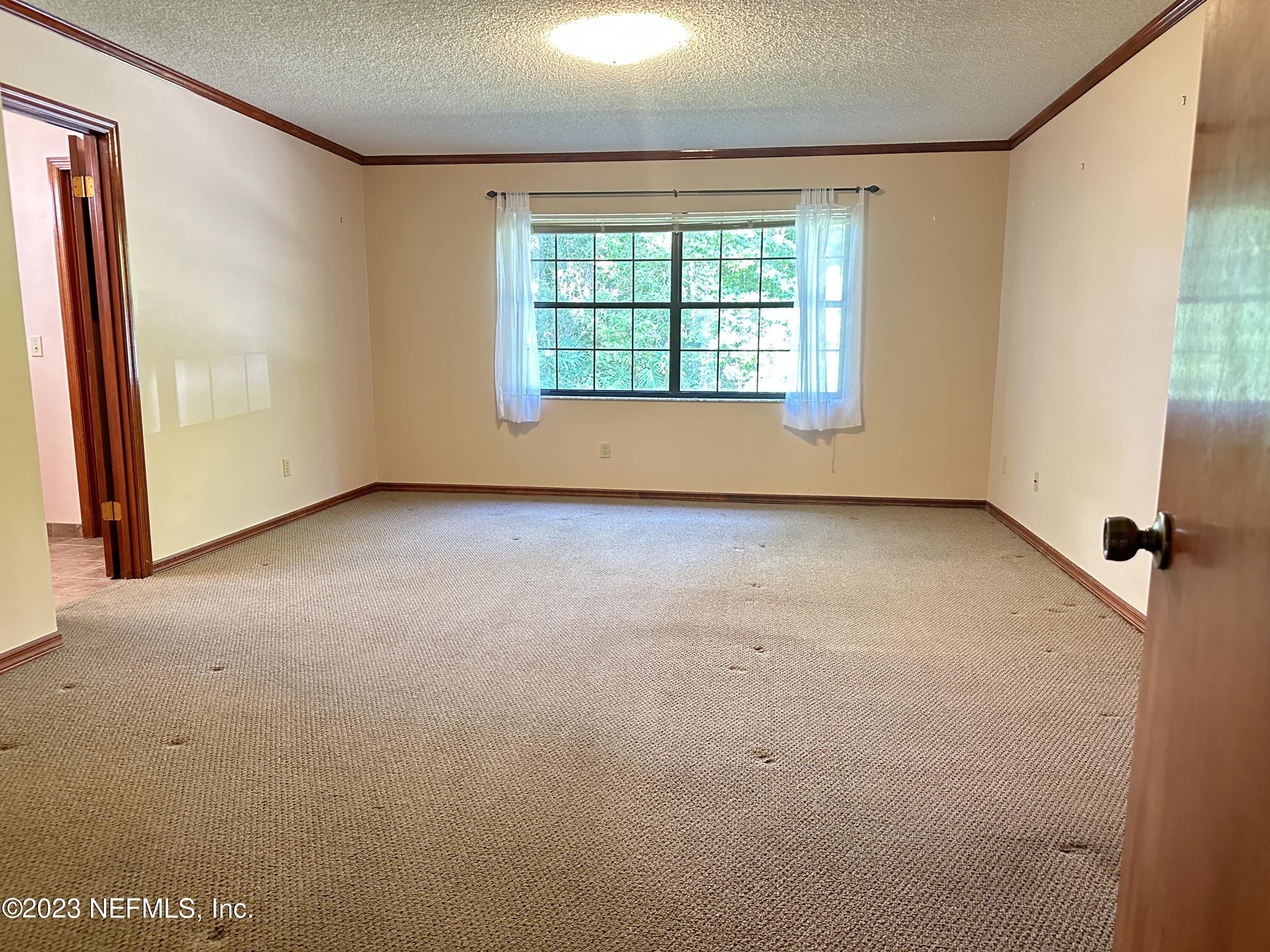 2797 Kings Road St. Augustine, FL 32086 - Photo 10 of 24 an empty room with windows