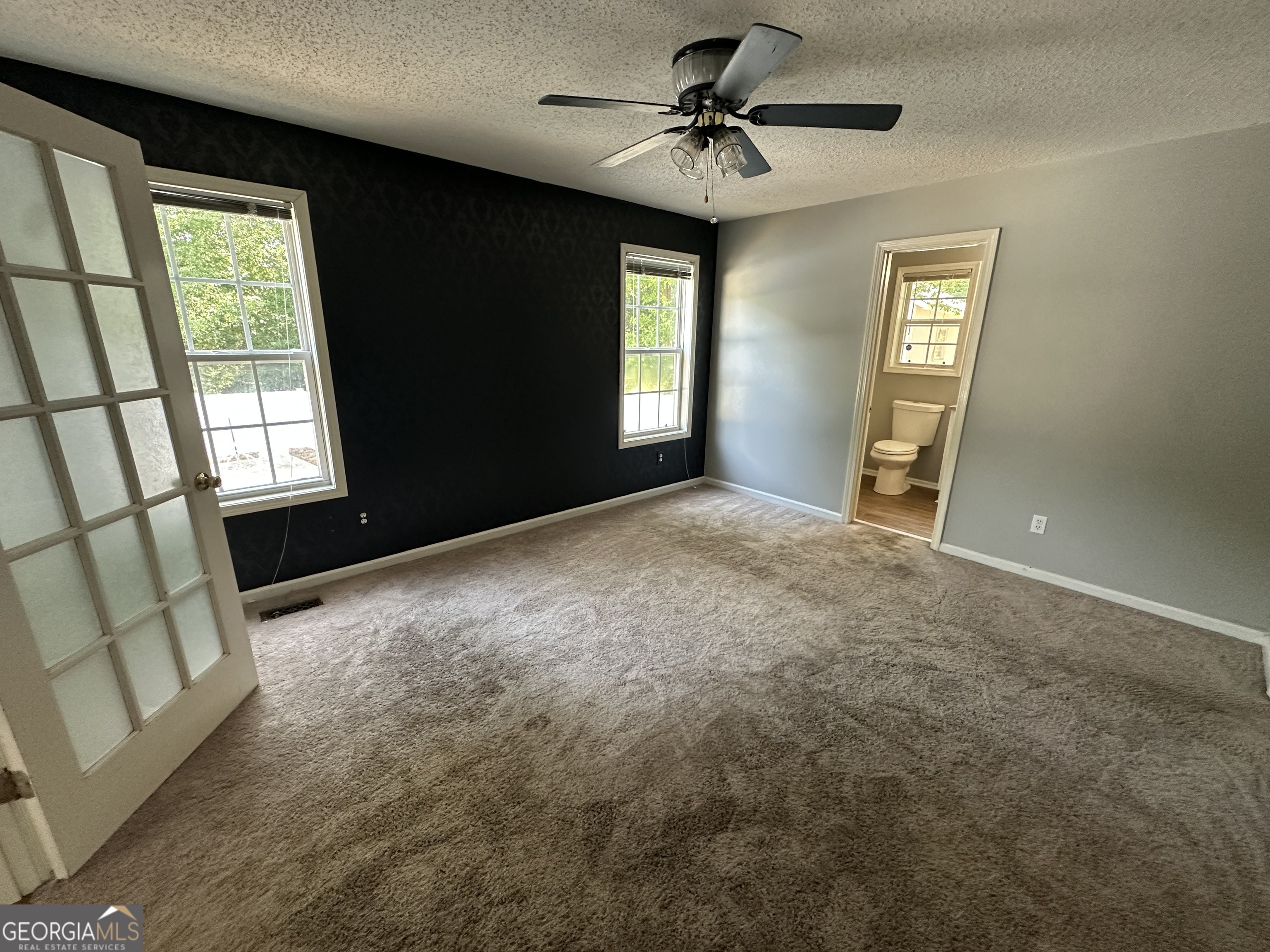 384 Sam Brown Boulevard Commerce, GA 30529 - Photo 13 of 25 a view of empty room with windows