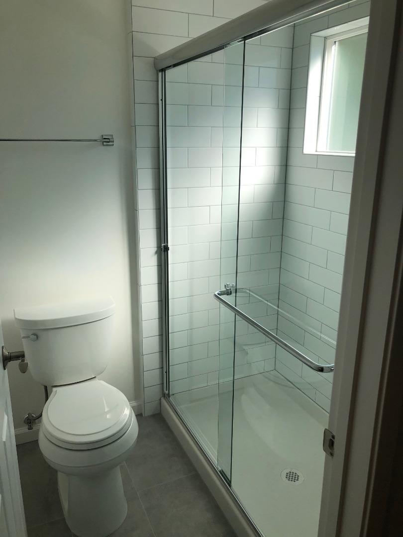 10304 Vista Drive, Unit B Cupertino, CA 95014 - Photo 12 of 16 a bathroom with a toilet and a shower