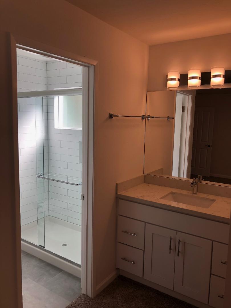 10304 Vista Drive, Unit B Cupertino, CA 95014 - Photo 14 of 16 a bathroom with a sink and mirror