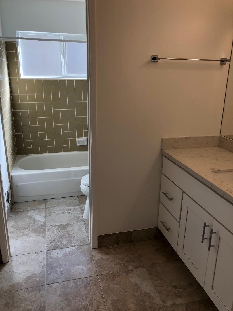 10304 Vista Drive, Unit B Cupertino, CA 95014 - Photo 8 of 16 a bathroom with a sink a toilet and bathtub