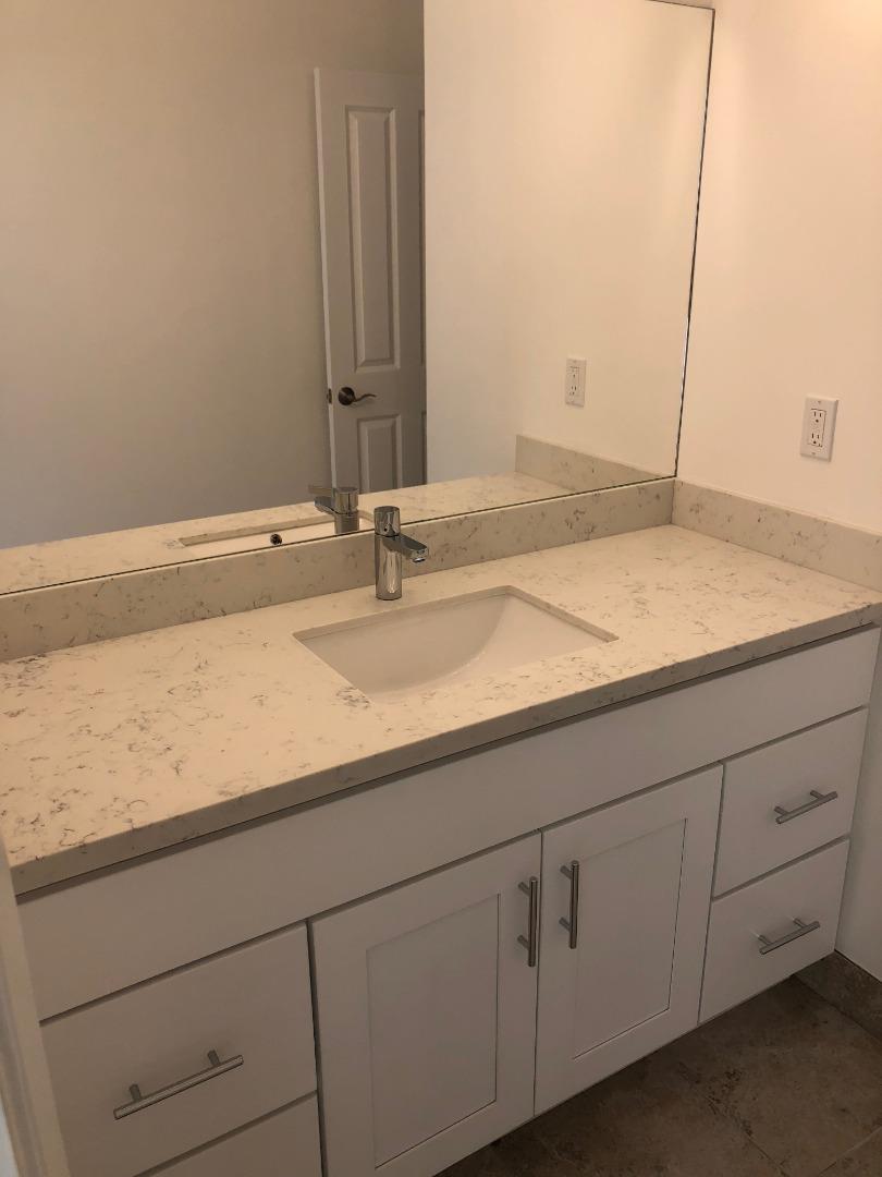 10304 Vista Drive, Unit B Cupertino, CA 95014 - Photo 9 of 16 a bathroom with a sink and vanity