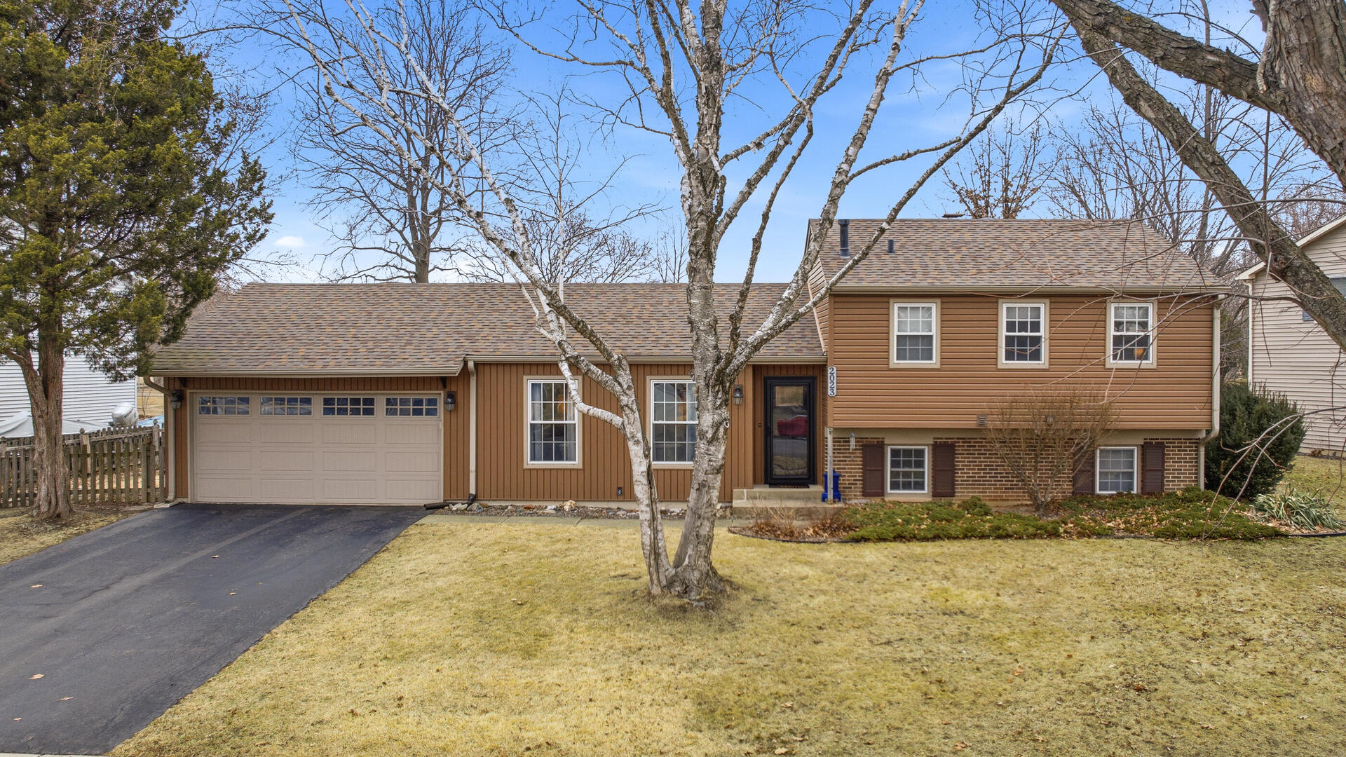 2023 Springside Drive Naperville, IL 60565 - Photo 1 of 16 front view of house with a yard