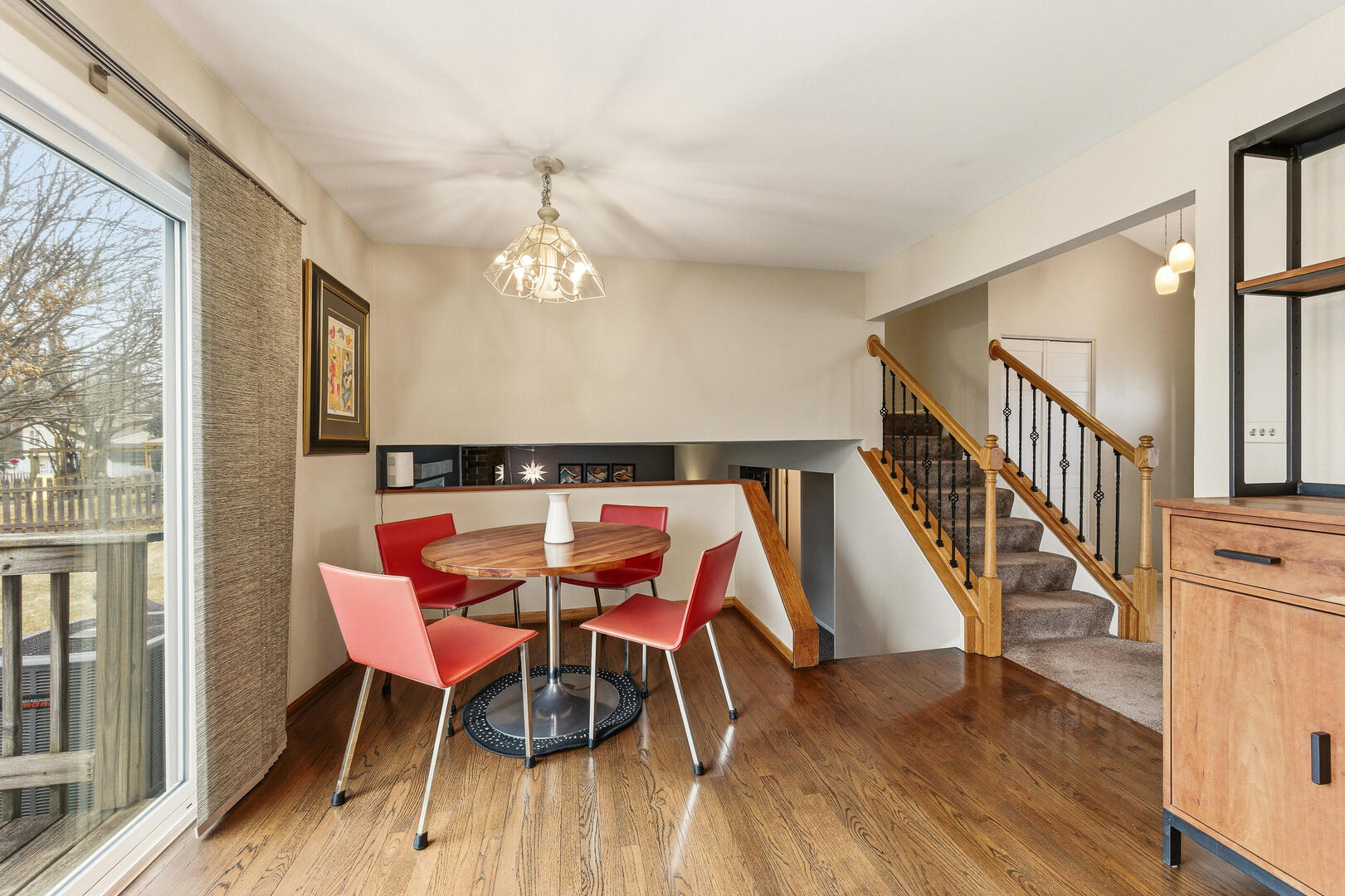 2023 Springside Drive Naperville, IL 60565 - Photo 9 of 16 a dining room with furniture and wooden floor