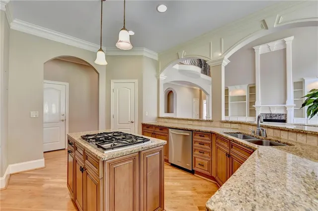 a view of a livingroom with wooden floor and furniture