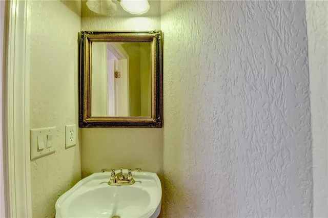 a living room with a fireplace and a fireplace