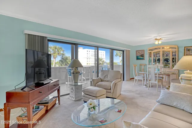 a kitchen with cabinets and chairs