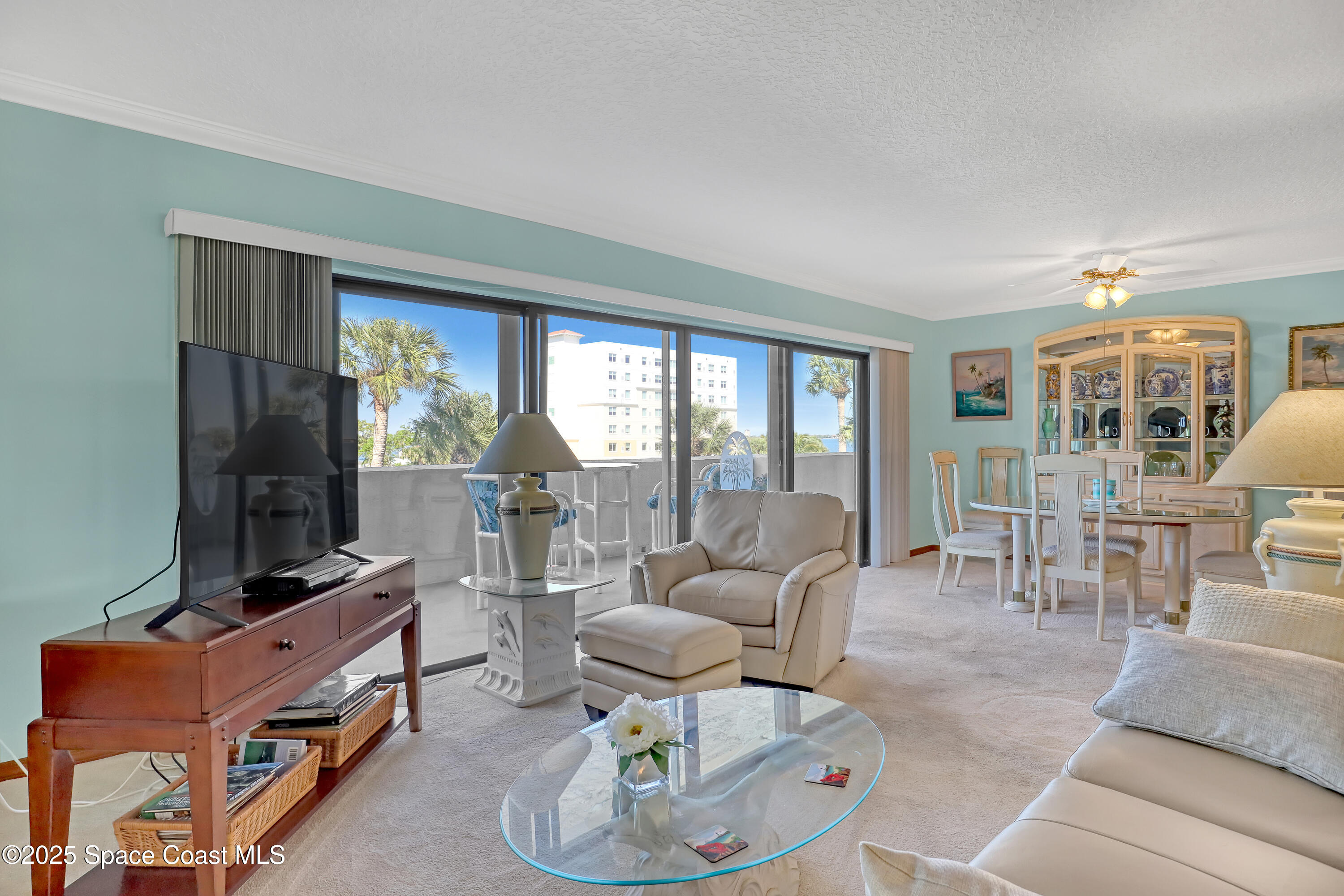5011 Dixie Highway Northeast, Unit A209 Palm Bay, FL 32905 - Photo 15 of 44 a living room with furniture fireplace and a large window