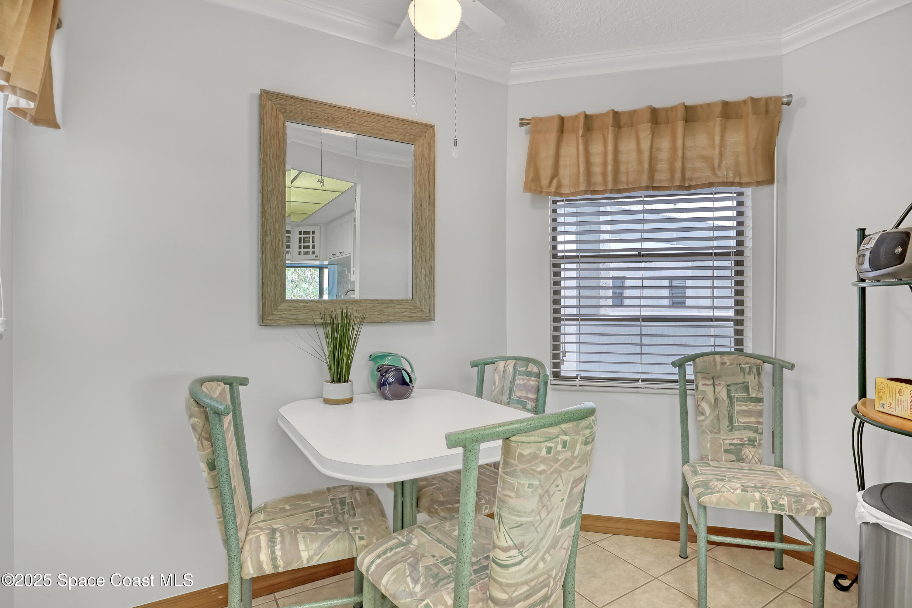 5011 Dixie Highway Northeast, Unit A209 Palm Bay, FL 32905 - Photo 19 of 44 a view of a dining room with furniture and wooden floor