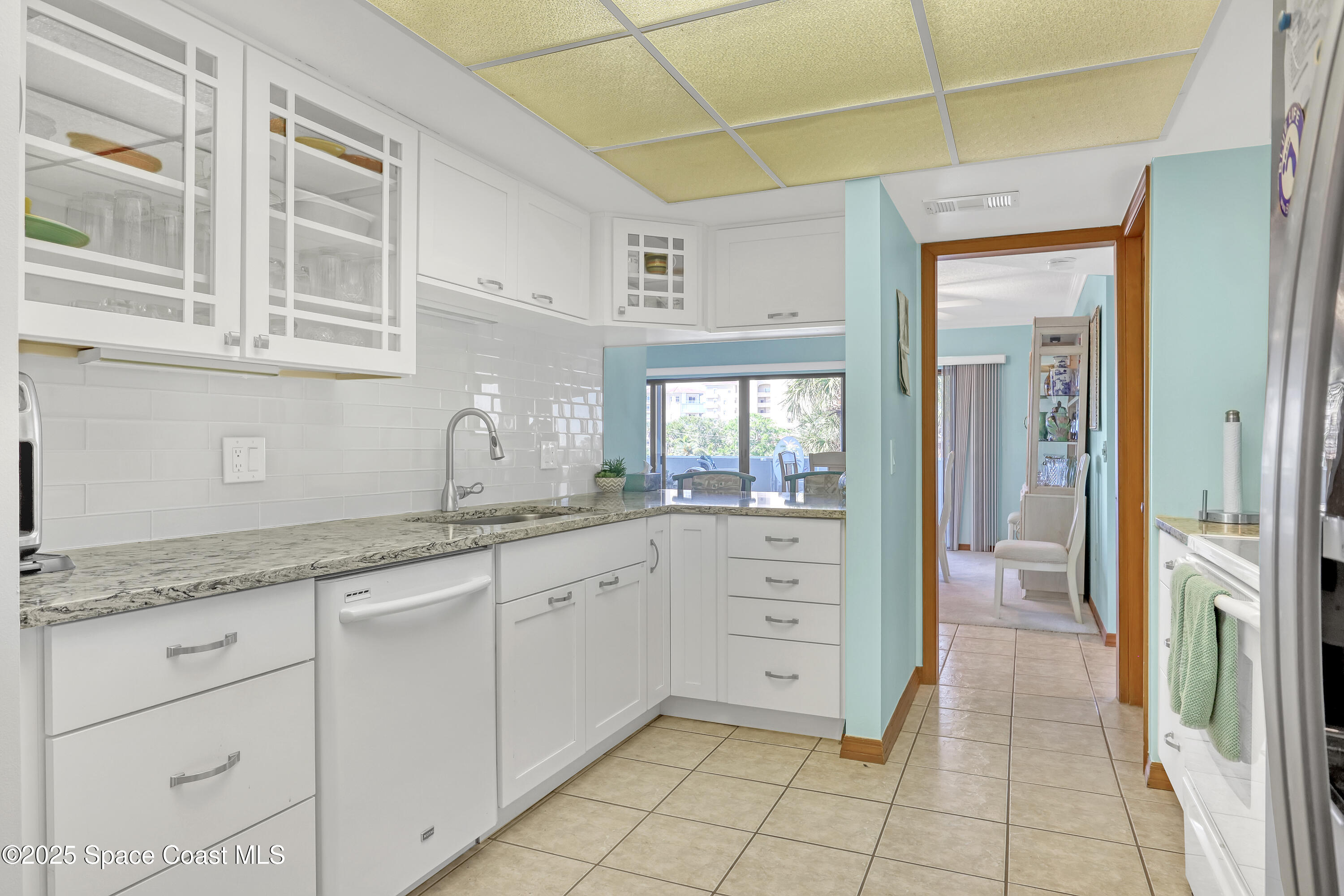 5011 Dixie Highway Northeast, Unit A209 Palm Bay, FL 32905 - Photo 21 of 44 a spacious bathroom with a granite countertop sink mirror and