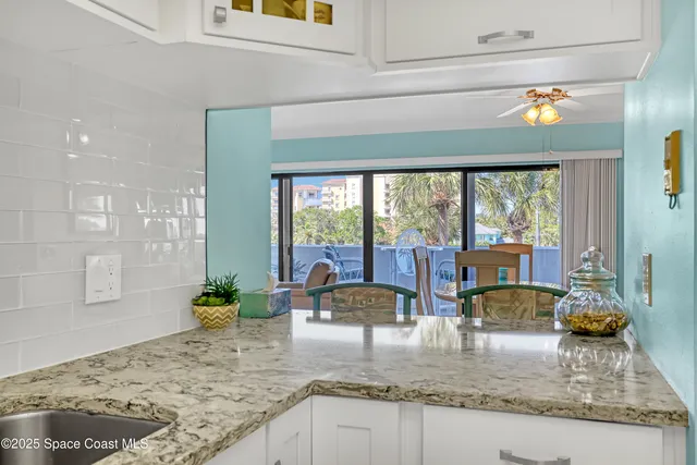 a balcony with chairs and with table